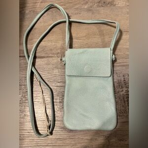 Free People "Let’s Dance" Crossbody — a mini handbag in turquoise. Tuck your pho